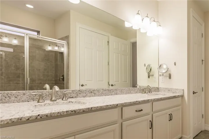 Bathroom featuring vanity and walk in shower