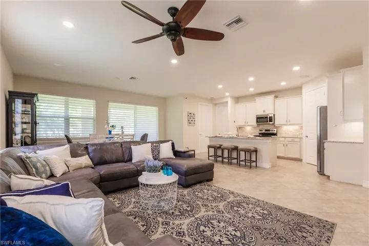 Tiled living room with ceiling fan