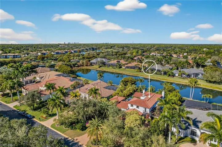 View of property location featuring a nearby body of water and nearby suburban area