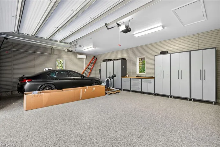 Garage featuring a garage door opener