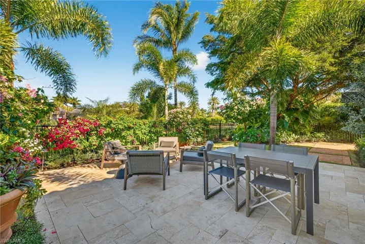 Fenced backyard with an outdoor living space, outdoor dining space, and a patio