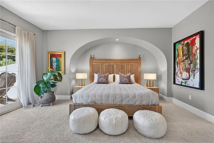 Bedroom featuring access to exterior and carpet