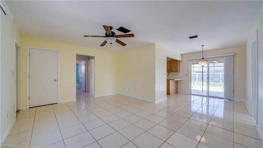 Family room, dining room and sliding door to lanai and pool