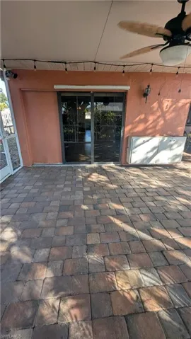 View of patio with a ceiling fan