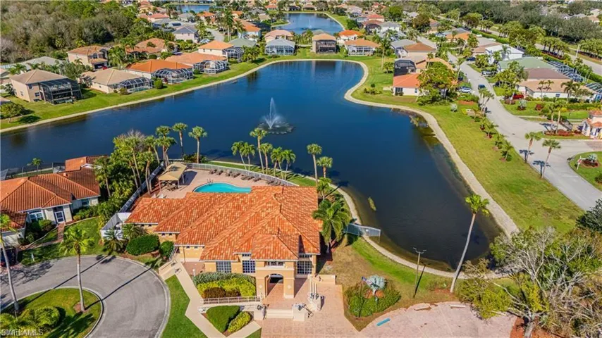 Aerial perspective of suburban area with a nearby body of water