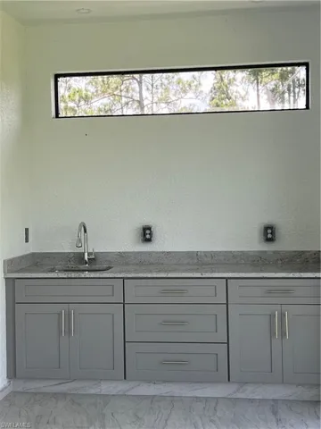 Bathroom featuring marble finish flooring