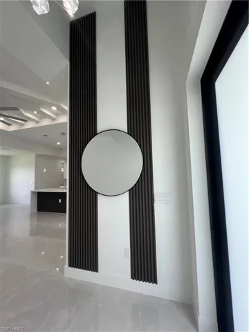 Detailed view of recessed lighting and baseboards