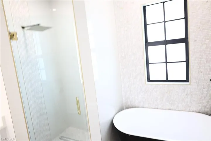 Spare room featuring baseboards and ceiling fan