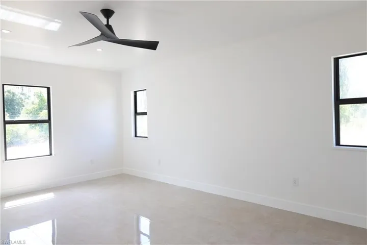 Unfurnished room with a chandelier and recessed lighting