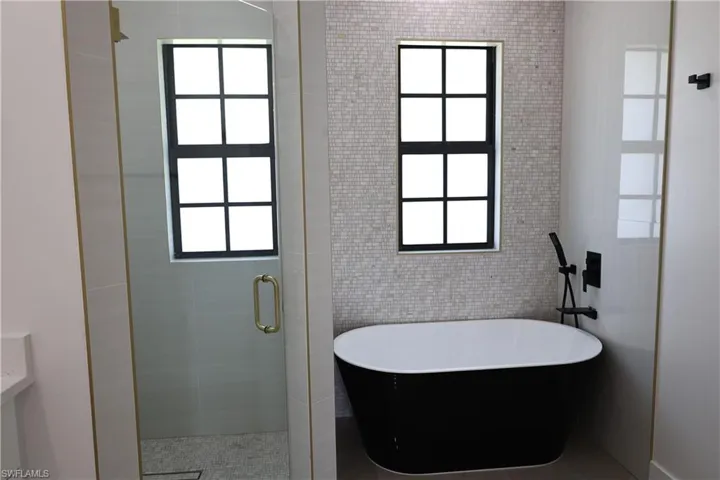 Bathroom with vanity and light tile patterned floors