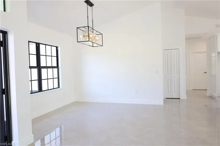 Dining room with a chandelier and french doors