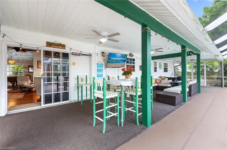 View of patio featuring ceiling fan and outdoor lounge area