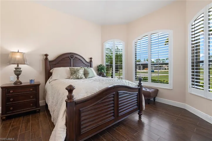 Bedroom featuring dark hardwood / wood-style flooring