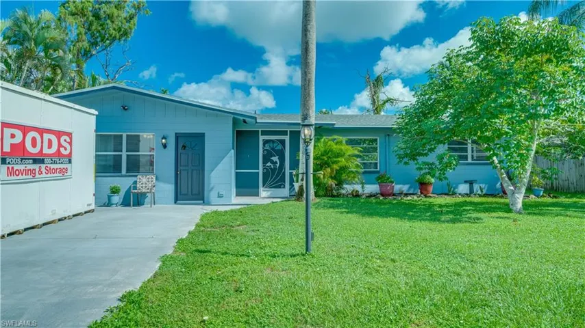 Ranch-style home with a front yard