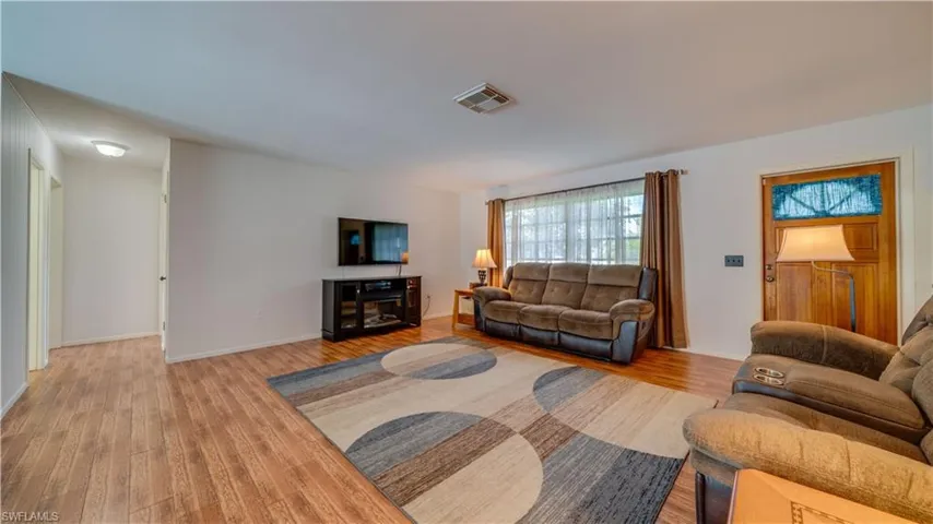 Living room featuring hardwood / wood-style flooring
