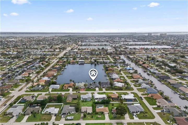Drone / aerial view featuring a water view and a residential view
