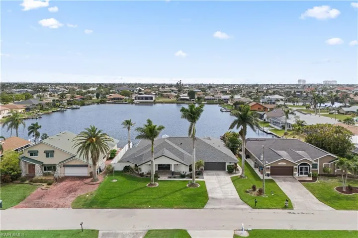 Bird's eye view with a water view and a residential view