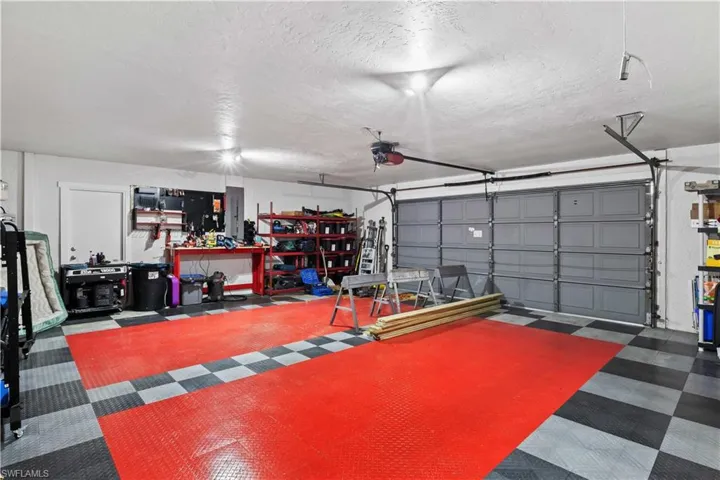 Garage featuring a garage door opener