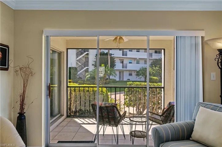 Living room opens to screened lanai. Parking space is next to lanai.