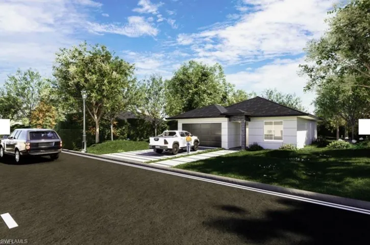 Single story home with an attached garage, a front yard, and driveway