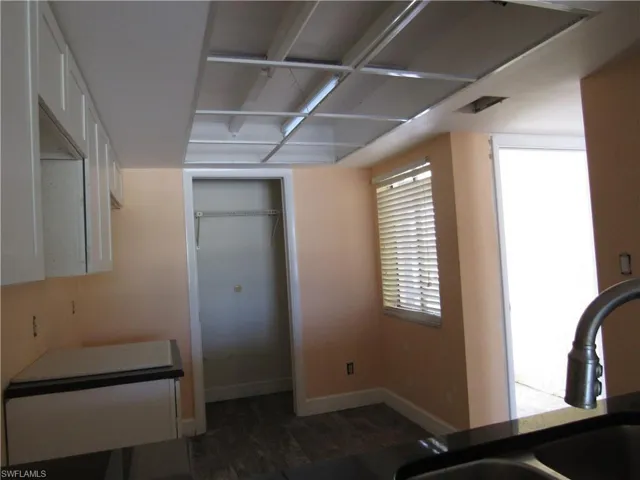 Workout room featuring dark wood-type flooring