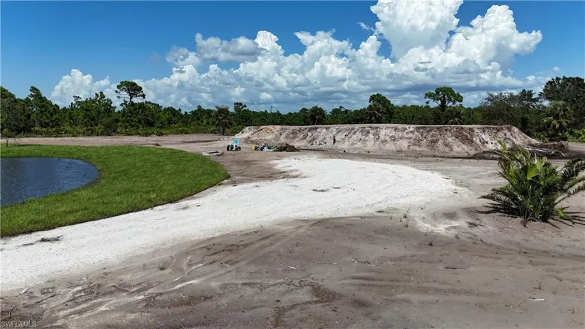 View of dirt / gravel road featuring a water view