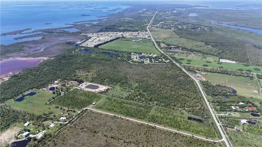 Aerial overview of property's location featuring a nearby body of water
