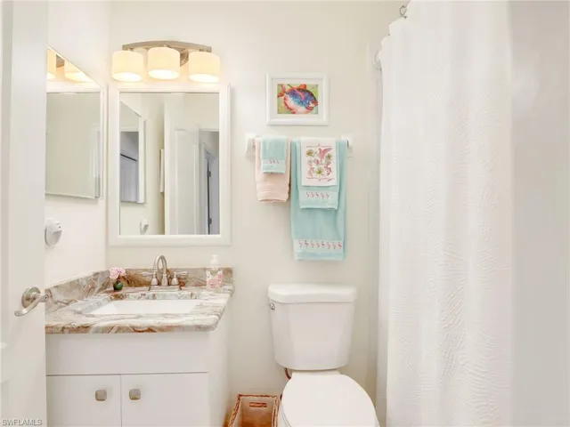 Bathroom featuring vanity and toilet