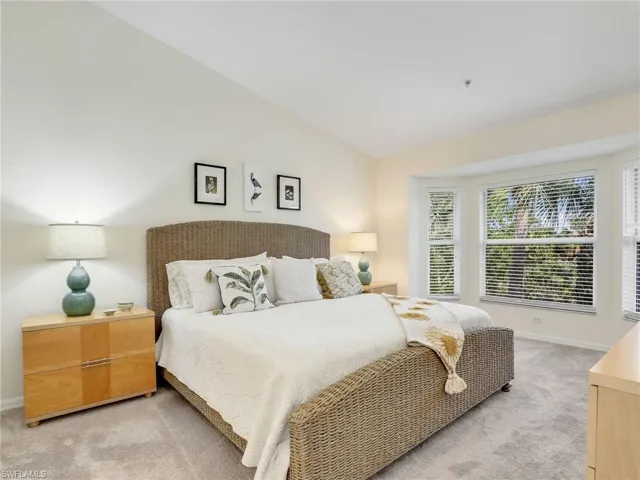 Bedroom featuring vaulted ceiling