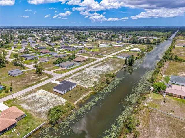 Aerial view of residential area with a large body of water