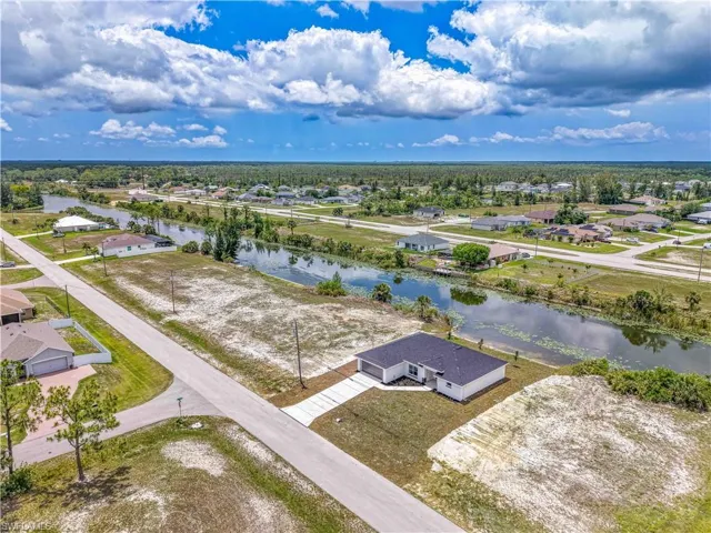 Aerial view of residential area featuring a large body of water