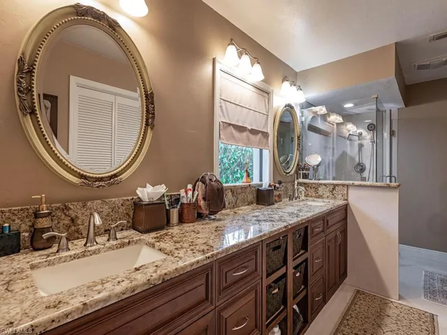 Bathroom featuring tile patterned floors and vanity