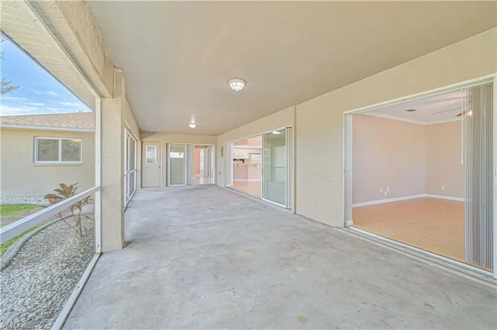 Unfurnished sunroom featuring a wealth of natural light
