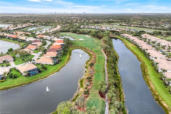 View of property location with a large body of water and nearby suburban area
