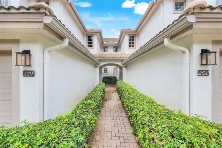 Entrance to property featuring stucco siding and a garage