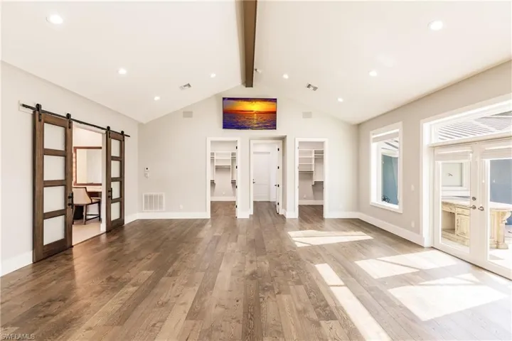 Primary bedroom with two walk-in closets