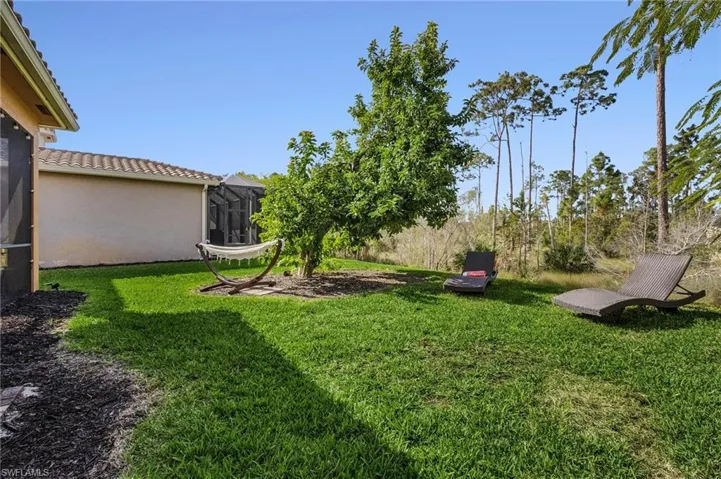 View of green lawn with glass enclosure
