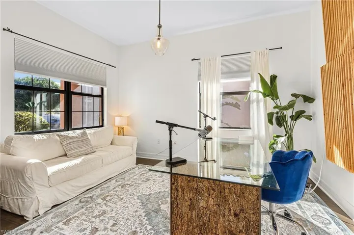 Living room featuring baseboards and wood finished floors