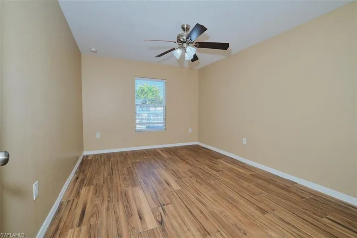 Spare room with light wood-type flooring and a ceiling fan