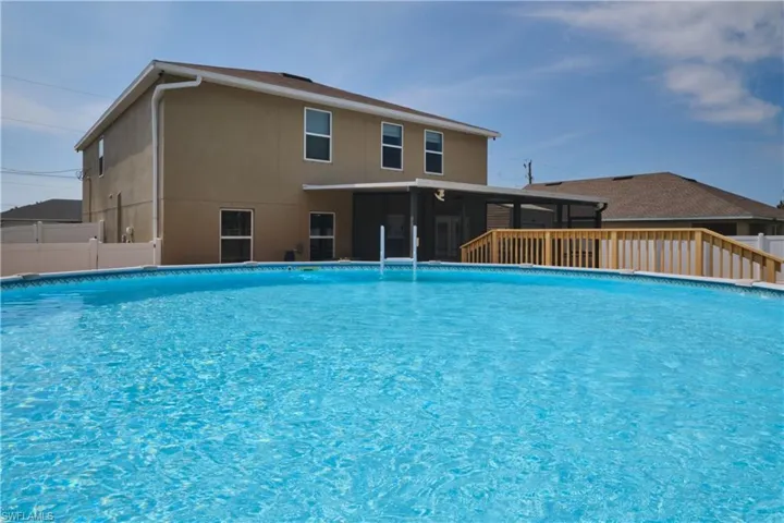View of pool featuring a sunroom