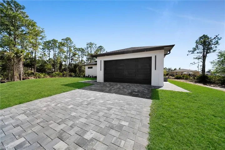 Garage with decorative driveway