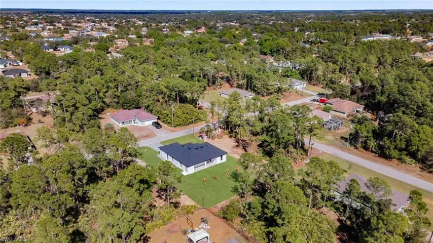 Aerial view of property's location featuring nearby suburban area