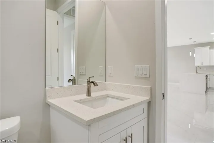 Bathroom with vanity and toilet