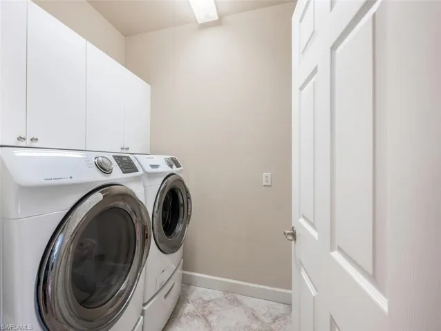 Laundry Room w/Washer/Dryer, Cabinetry & Sink Behind Door