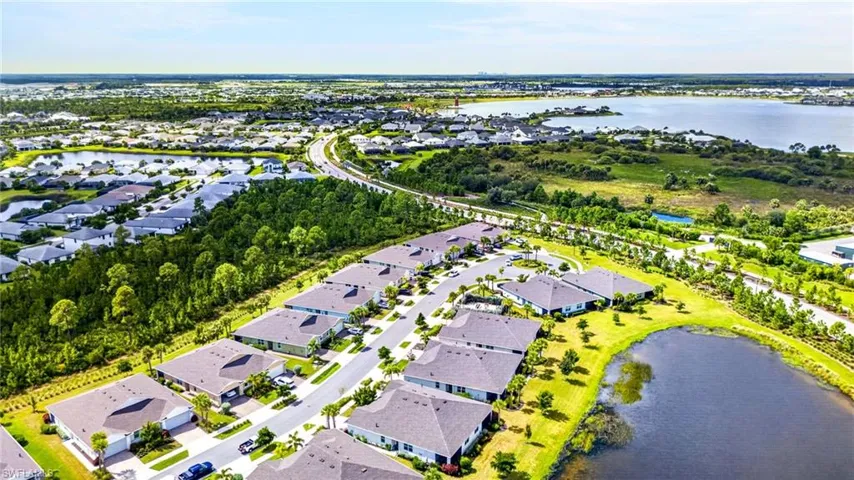 Community featuring a substantial body of water, extensive green spaces, and established residential areas