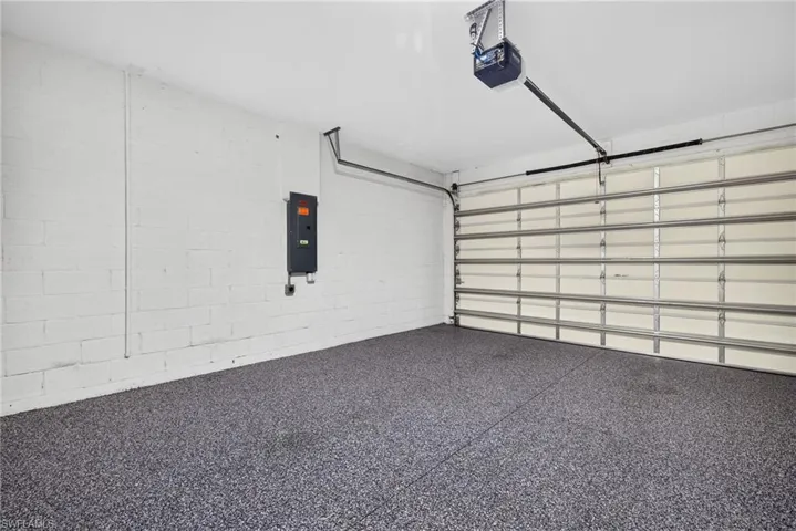 Epoxy coated flooring, painted block walls, automatic garage door opener, and a panel heater