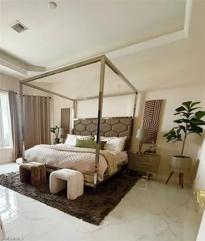 Bedroom with marble tiled flooring