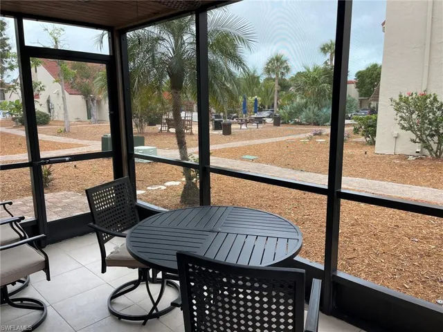 Sunroom featuring outdoor dining space