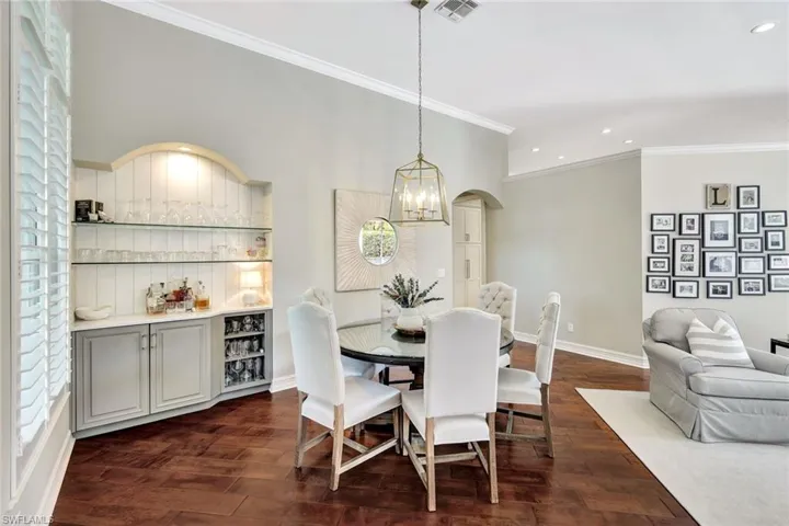 Formal dining with dry-bar open to living room