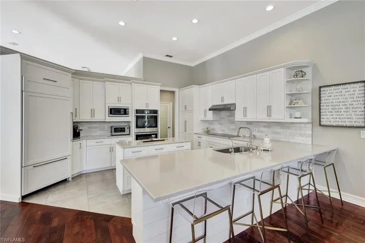 Quartz countertops with ample breakfast bar seating